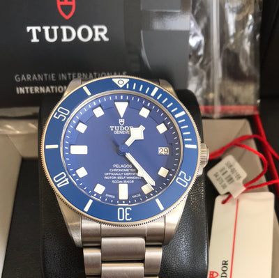 Titanium Case wrist watch on blue dial and titanium bracelet