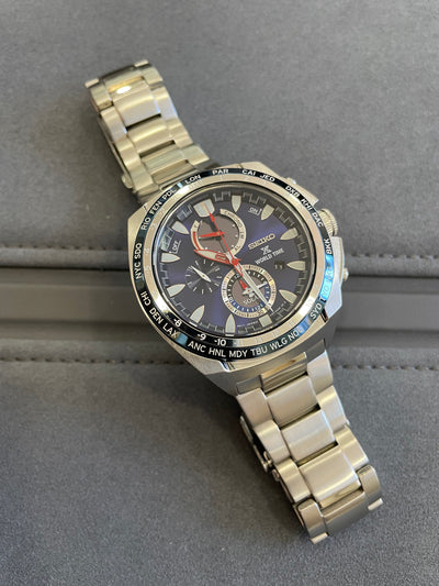 steel wristwatch with blue dial and chrono subdial on steel bracelet 