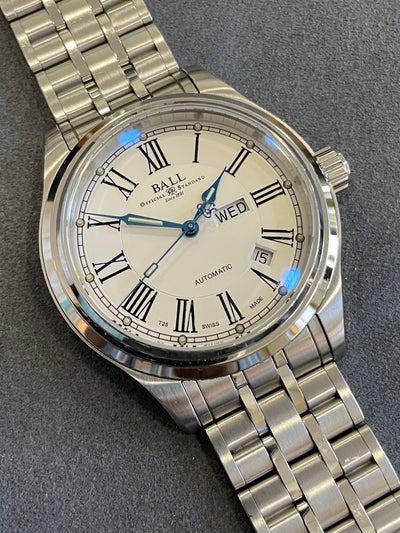 steel wristwatch on white Dial and steel bracelet