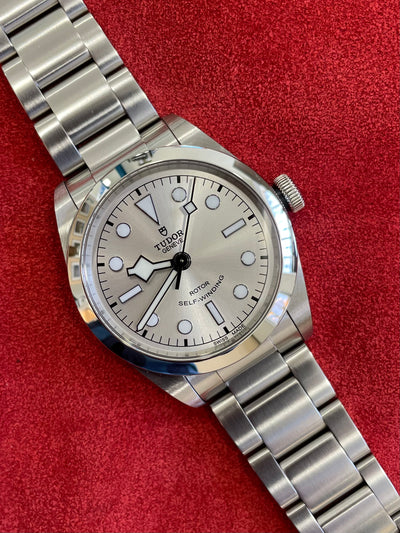 steel wristwatch on silver dial and steel bracelet