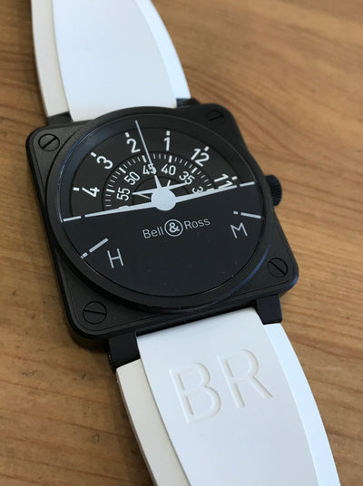Black Wristwatch on aviation inspired dial and white strap 