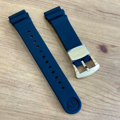 black silicon wristwatch with gold buckle