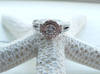 Engagement two tone Diamond ring displayed on top of a Sea Star